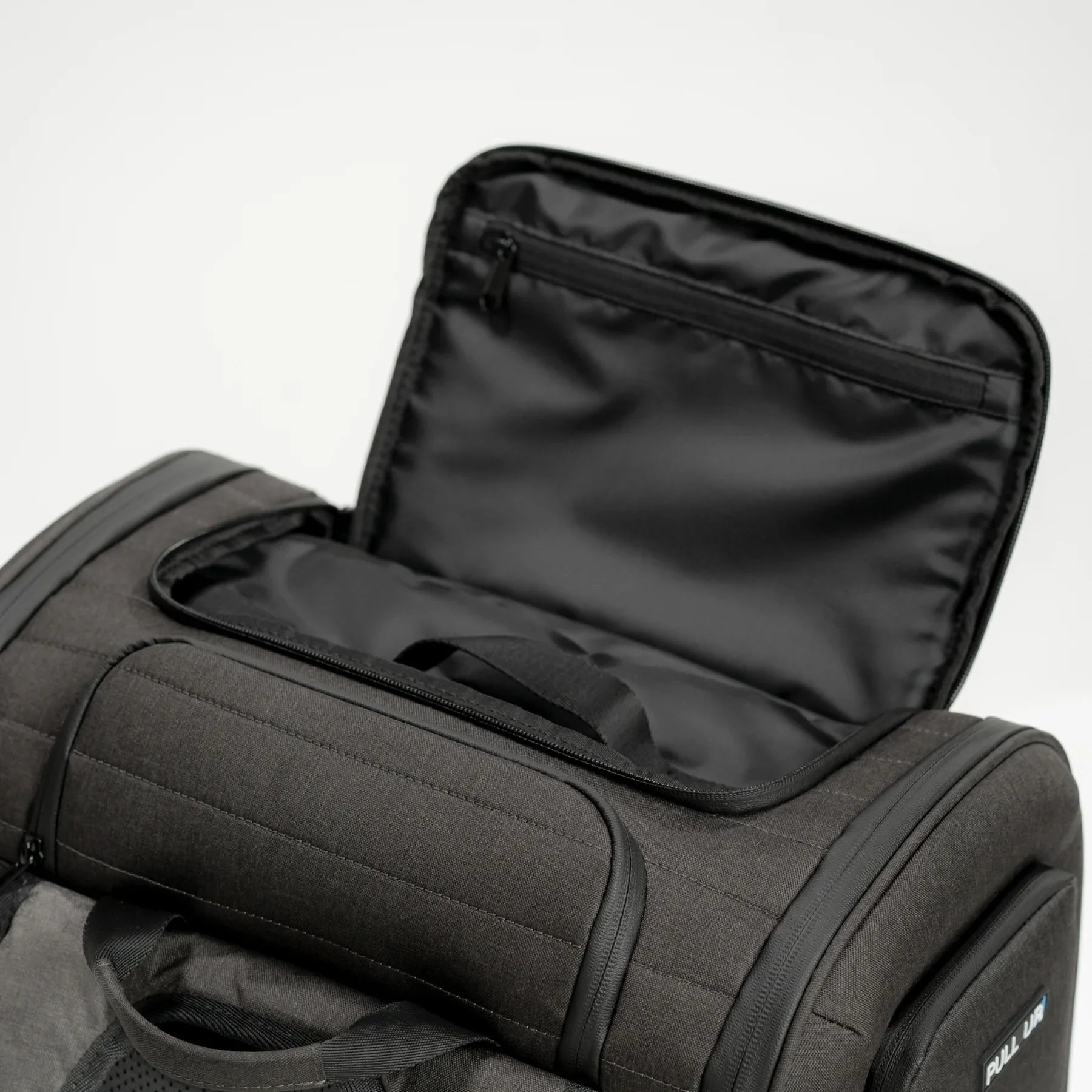 Pull Up Backpack being used by a traveler – mobile compartment for passport, smartphone or accessories